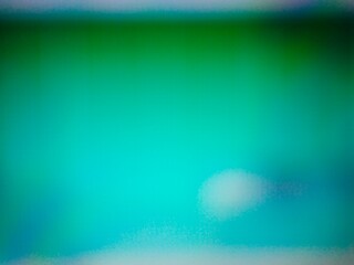 A vibrant and abstract gradient transition displaying a blend of emerald green and bright aqua hues...