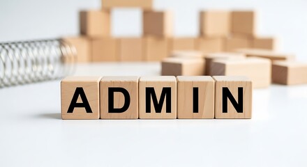 Wooden blocks with the word admin spelled out, symbolizing administration and management, isolated on white background