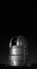 Astronomical observatory structure, prominently showcasing its metallic dome and intricate architecture, stands beneath a star-filled night sky, suggesting a focus on celestial observation and the...