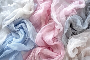 Obraz premium A vibrant arrangement of soft, flowing fabrics in pastel colors, creating an elegant texture and visual appeal.