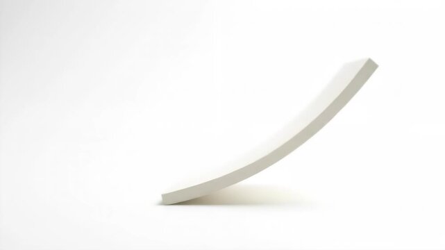 A curved white shape stands out against a seamless white background, created with soft lighting. This minimalist composition offers versatility for many uses.