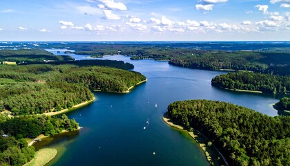 Fototapeta premium Scenic lake, dense forests, aerial view