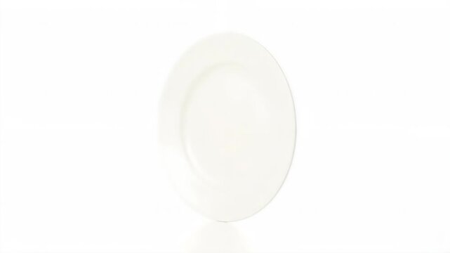 Minimalist white ceramic plates are isolated on a white background. Clean round shapes for serving or decoration. Bright, plain design for food presentation.