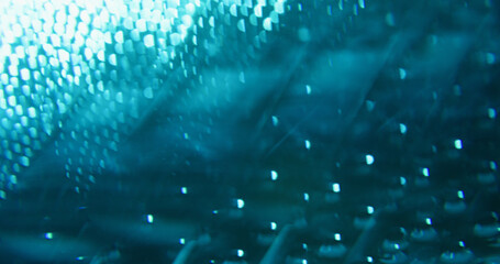 Blur illuminated gleam. Shiny texture. Vivid blue color round optical lens flare steam on abstract...