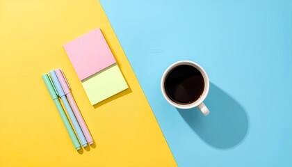Flat Lay Of Morning Coffee Pens And Sticky Notes On Colorful Yellow And Blue Background