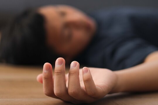 Closeup Hand of Child Unconscious on the Floor - Powered by Adobe
