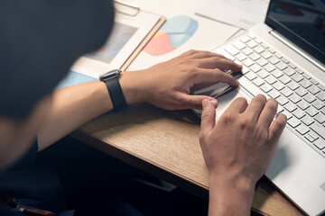 Close up, Businessman hand typing on laptop computer keyboard. surfing the internet, online working. corporate business concept.