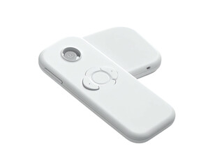 A white, futuristic-looking remote control and charging base resting on a black background