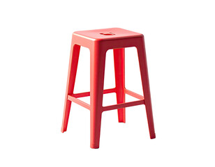 A vibrant coral-colored stool, isolated against a black background, is brightly lit