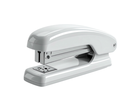 A gleaming white office stapler, ready for use, isolated on a black background