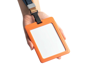 Hand holding an orange badge with a blank white card, lanyard attached