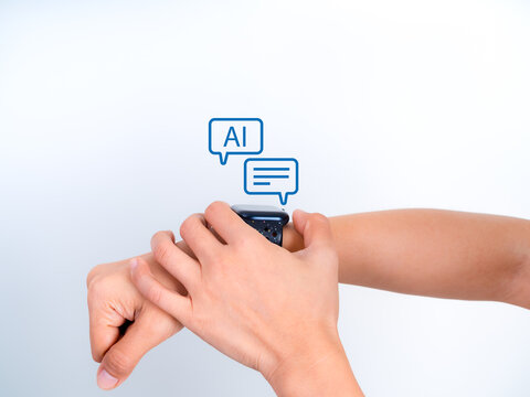 AI chatbot assistant speech bubble interface on smartwatch held by human hands. Concept of modern wearable technology with virtual communication and artificial intelligence on digital device.