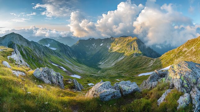 Panoramic view of fagaras mountain ridge in summer with clouds and snow