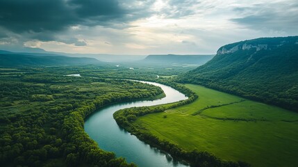 Scenic green landscape under cloudy sky with peaceful nature view
