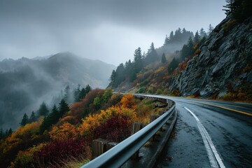 A curvy road cuts through misty mountains with autumnal colored foliage. Showcase travel, nature, and scenic drives during fall season easily.