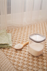 baking soda powder and cleaning cloths on a carpet 