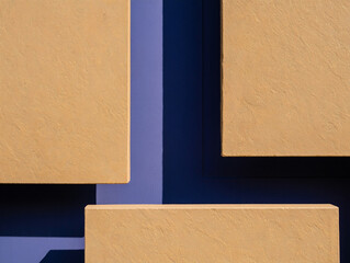Fototapeta premium Textured Tan Rectangles Against Deep Blue Background