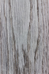 background is made of old gray wood. an old board. the texture of a rustic table. ash tree, a place for a text or object. view from above. the effect of aging, vertical, close-up.