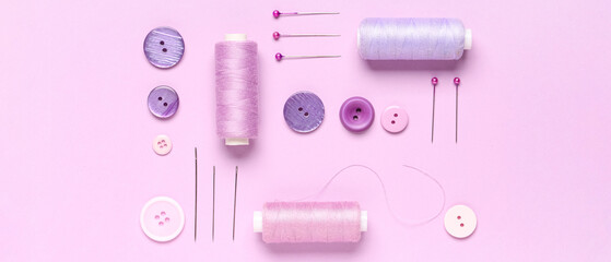 Thread and sewing supplies on lilac background, top view