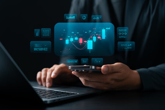 Stock trading and financial data analysis concept, businessman using smartphone and laptop, digital candlestick chart interface represents investment, fintech, and online trading.