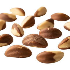 Fototapeta premium Close-up of many oval-shaped nuts with brown and tan halves, floating on black