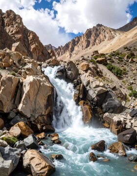 Mtn waterfall cascading down rocks