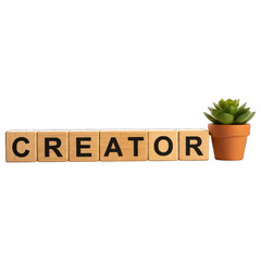Wooden blocks spell "CREATOR", next to a potted succulent. Plain black background