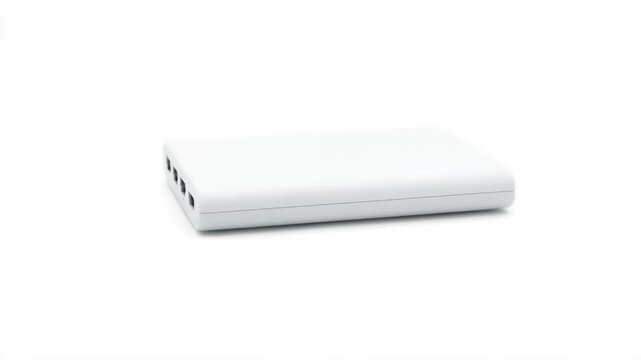 Close up of a white portable power bank featuring four ports displayed against a clean, isolated white background. Suitable for showcasing minimalist tech accessories.