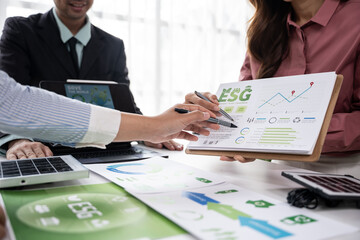 Collaborative esg strategy meeting corporate office business presentation modern workspace professional perspective sustainability focus