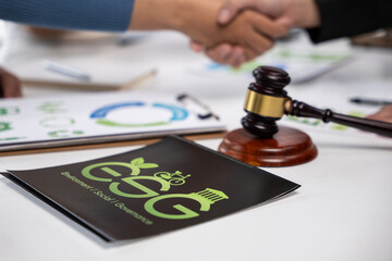 Collaborative agreement signing for esg initiatives office setting business meeting professional environment close-up view sustainability focus