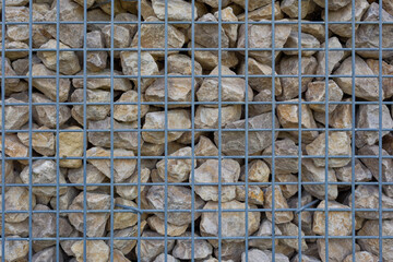 Close-up of a gabion fence filled with stones