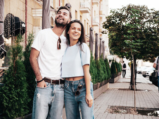 Smiling beautiful woman and her handsome boyfriend. Woman in casual summer jeans clothes. Happy...