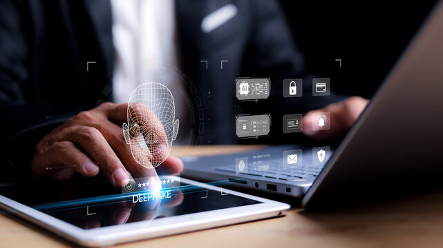 Deepfake detection and AI technology concept. Businessman using laptop and digital facial recognition interface for cybersecurity and identity verification.