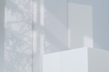 Obraz premium 3d white rectangular podium with soft window light and leaf shadows. clean minimal concept. bright studio scene for product branding advertising display. 3d render.