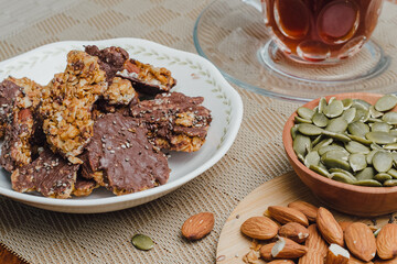 Healthy snack of granola with chia seeds and pumpkin seeds.