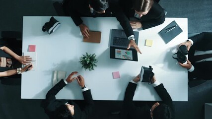 Top view of professional businessman give vr headset to diverse investors while young businesswoman looking at data analysis or marketing statistic on laptop and prepare for data sharing. Directorate. - Powered by Adobe