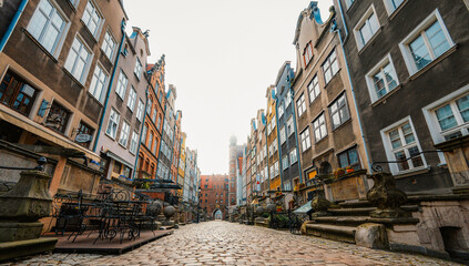 Gdansk with Motlawa river in Poland. Old town colourful house with church and Mariacka street