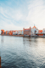Obraz premium Gdansk with Motlawa river in Poland. Old town colourful house with Stragania Gate