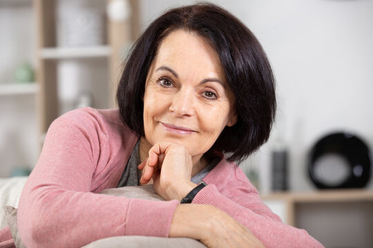 happy middle aged woman relaxing at home