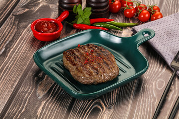 Grilled beef burger cutlet with sauce