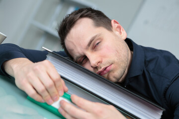 Fototapeta premium tired businessman sleeping in office