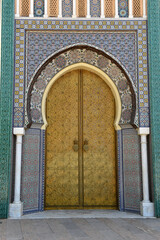 Brass door with Arabic calligraphy and Moroccan zellij mosaic tilework. Royal Palace, Fez, Morocco