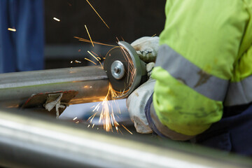 hot sparks flying in the air from a metal grinder