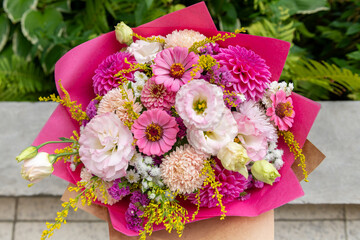 Summer bouquet. Beautiful pink fresh flower arrangement. Birthday or wedding bouquet made of summer flowers.