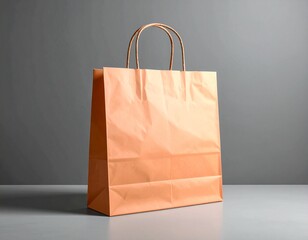 Simple orange paper shopping bag with handles on a grey background, perfect for retail and gifting.