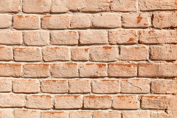 A brick wall with a tan color