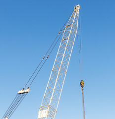 A crane is lifting a large object