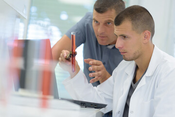 doctor with apprentice working in laboratory