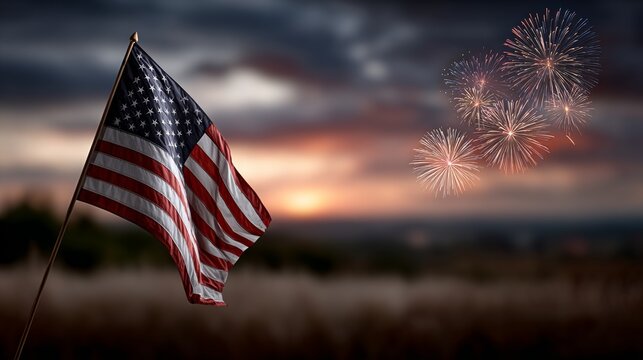 A vibrant American flag waves in the foreground, with colorful fireworks lighting up the sky at sunset, symbolizing celebration and patriotism.