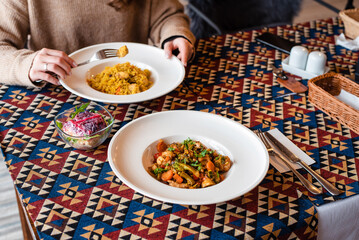 Colorful Dishes on Patterned Tablecloth